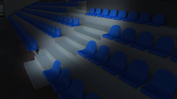 istock Night empty blue seats and stairs in a stadium 1186676076