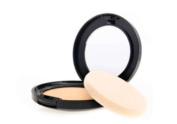 compact makeup powder in black round plastic case with mirror and sponge isolated on white background - powder puff imagens e fotografias de stock