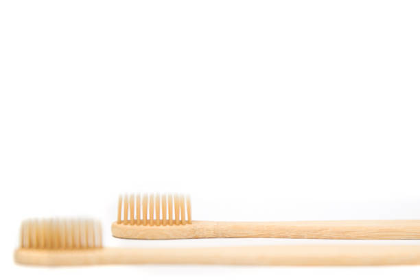 istock Bamboo toothbrushes isolated on the white background 1186677332