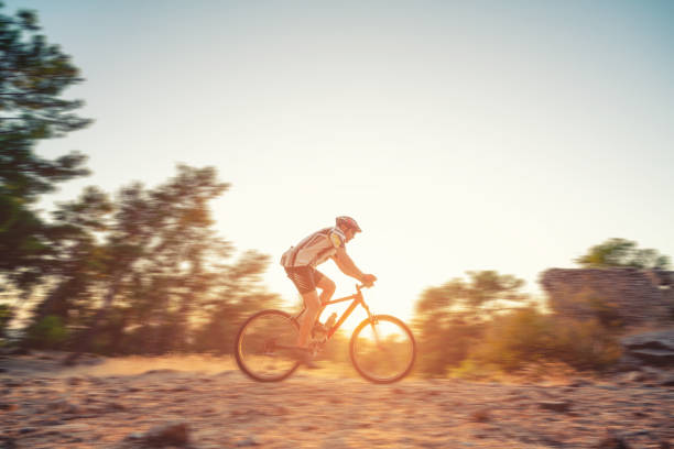 Man riding downhill mountain bike and isolated on white background