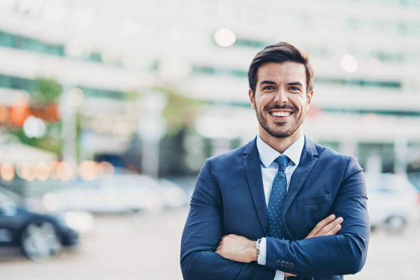istock Cheerful young man walking on the street 1186680134