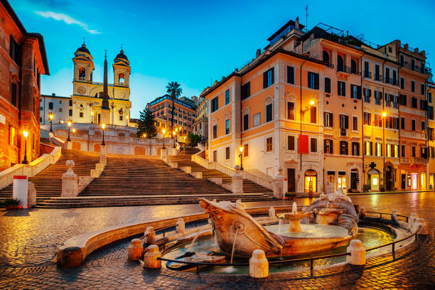 Barcaccia Fountain in The Spanish Steps Fontana della Barcaccia and Spanish Stepsat night in Rome rome stock pictures, royalty-free photos & images