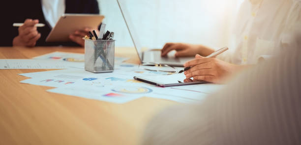 istock Teamwork Brainstorming Meeting and new startup project in workplace, Quality successful work concept, vintage effect. 1186684278
