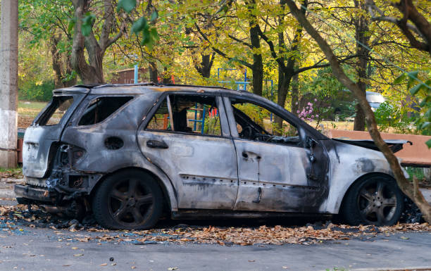 istock Fully burnt car on the street. 1186684291
