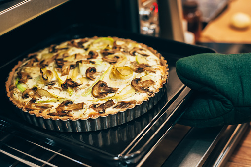 Homemade vegan quiche pie in hot oven