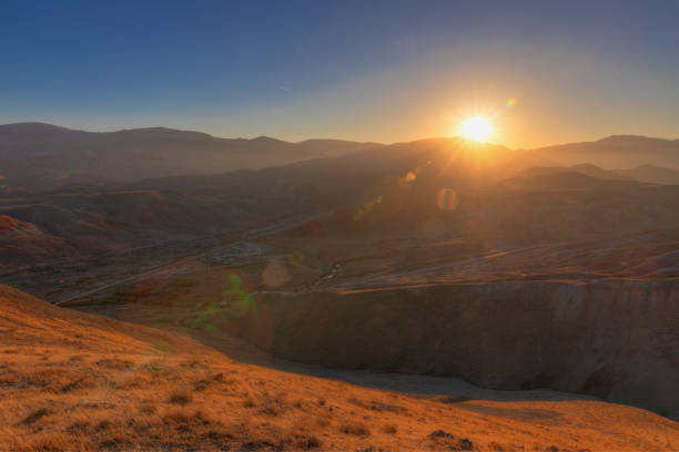 Red striped mountains at sunset day