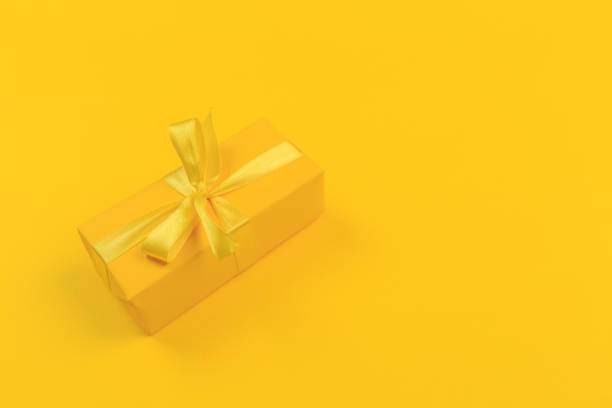 istock Gift box with ribbon and bow on color background and space for text. Top view 1186685511