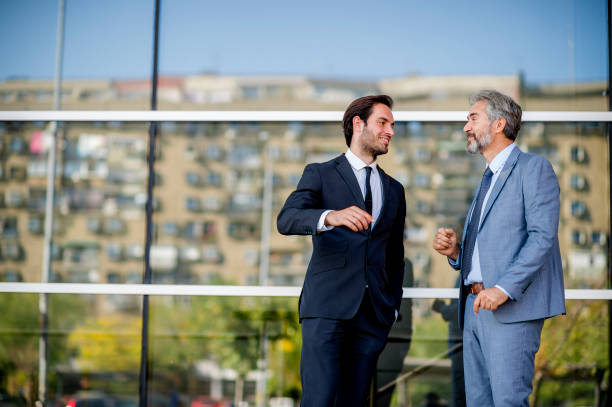 istock Two businessmen discussing about the new project 1186685663