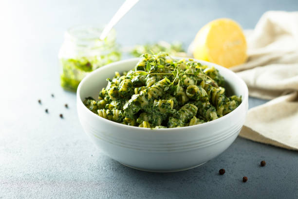 Pasta with pesto Pasta with homemade spinach pesto pesto sauce stock pictures, royalty-free photos & images