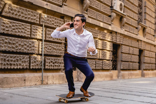 istock Young businessman on skateboard 1186689200