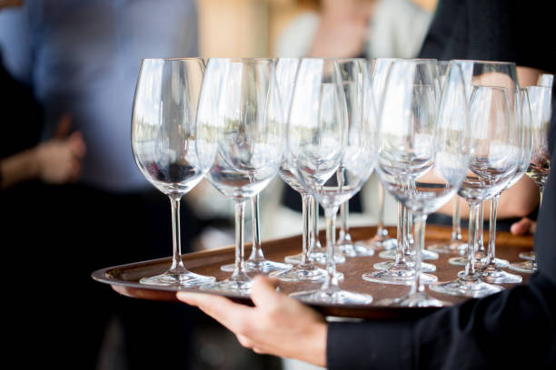 istock waiter with a tray of glasses 1186690249