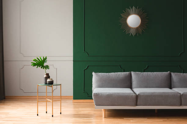 istock Modern coffee table next to living room sofa in simple interior 1186692974