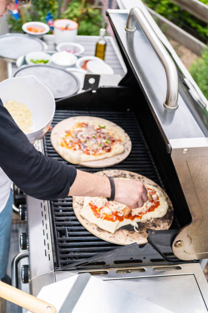 istock Preparing individual grilled pizzas 1186694220