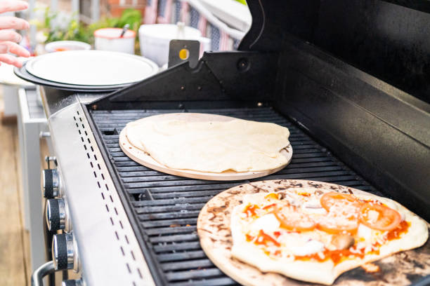 istock Preparing individual grilled pizzas 1186694518