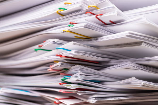 istock Stack overload document report paper with colorful paperclip place, business and paperless concept. 1186698099