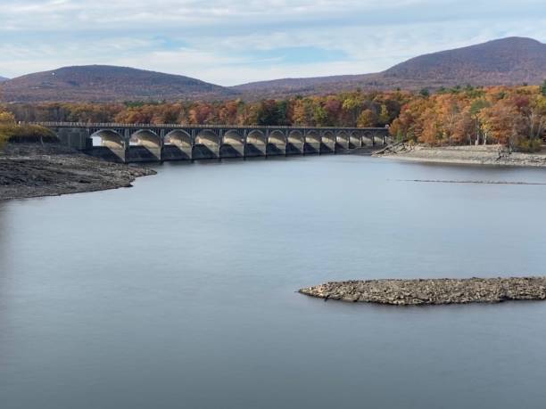 istock Old stone bridge over a lake during autumn 1186698241