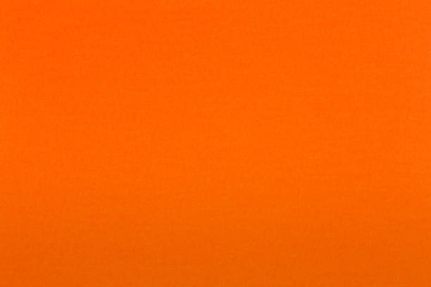 istock Light orange paper texture useful as a background. 1186698446