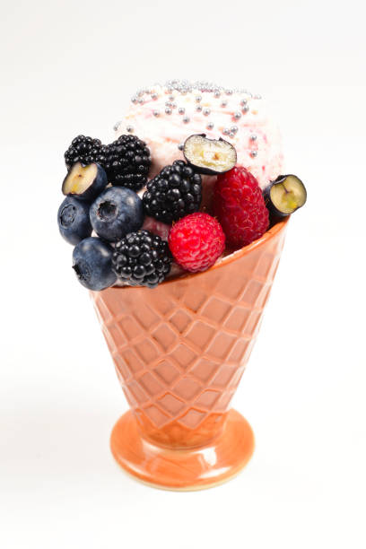 istock Ice cream with blueberries, blackberries and raspberries on a white background.  Copy space. 1186698528