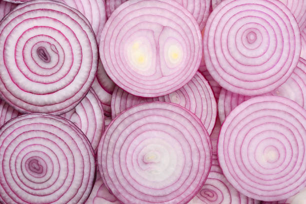 istock Onion slices as a background. Top view. 1186698543