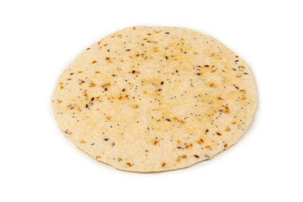 istock Pitta bread with seeds isolated on white 1186698622