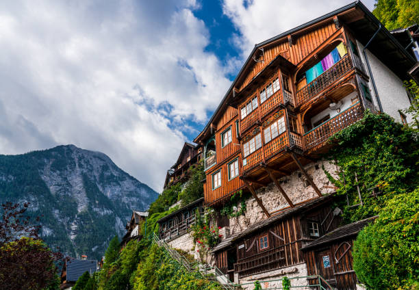 istock Typical Austrian Alpine house with bright flowers on the balcony 1186699477