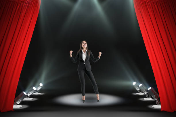 istock Happy businesswoman on stage 1186700724