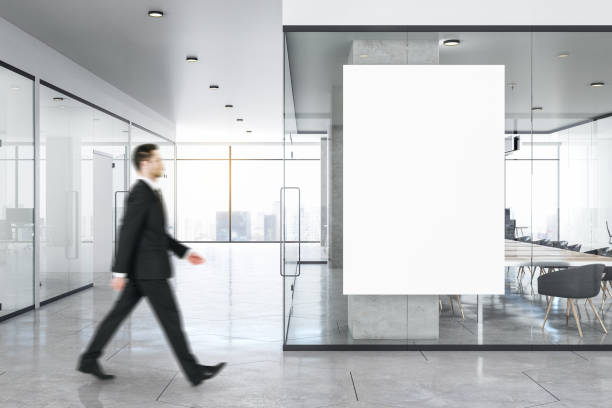 istock Businessman in modern concrete office interior 1186701214