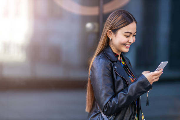 istock Attractive young woman with smartphone 1186702456