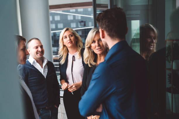 istock Team break - Colleagues taking a break from work, talking and laughing outside 1186703631