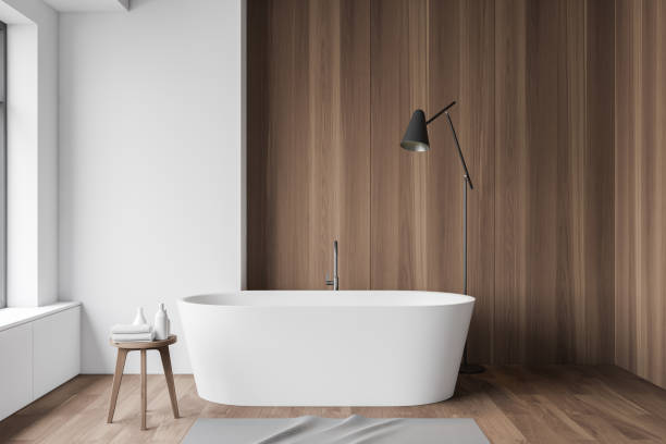 istock White and wood bathroom interior, tub and lamp 1186704197