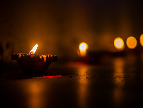 Traditional Diya lamp lit to celebrate the festival of light - Diwali