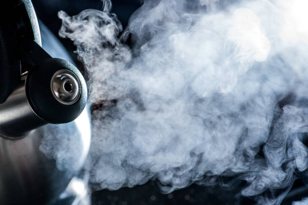 istock Steam going out of boiling tea kettle - close up shot 1186707330