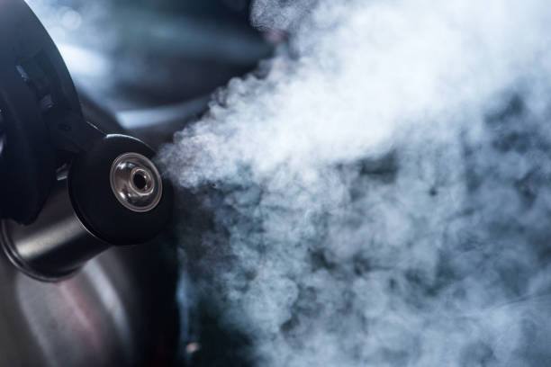 istock Steam going out of boiling tea kettle - close up shot 1186707367