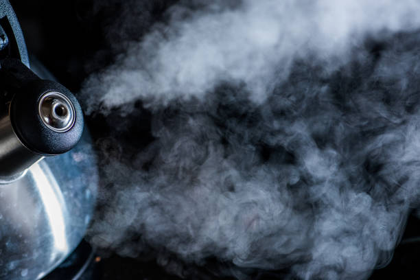istock Steam going out of boiling tea kettle - close up shot 1186707518