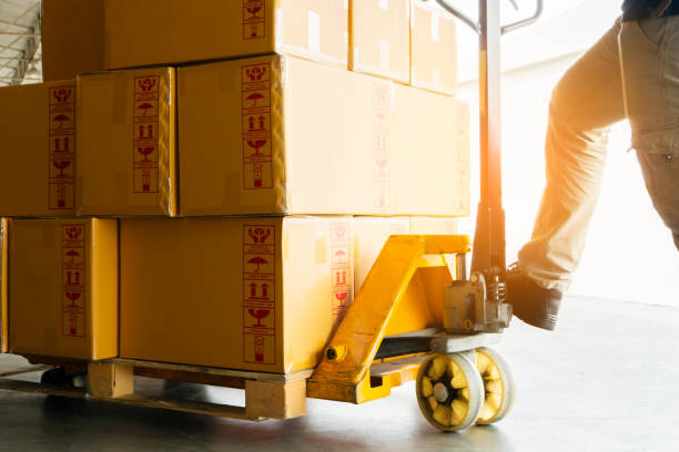 istock Close up hand pallet truck at warehouse 1186710179