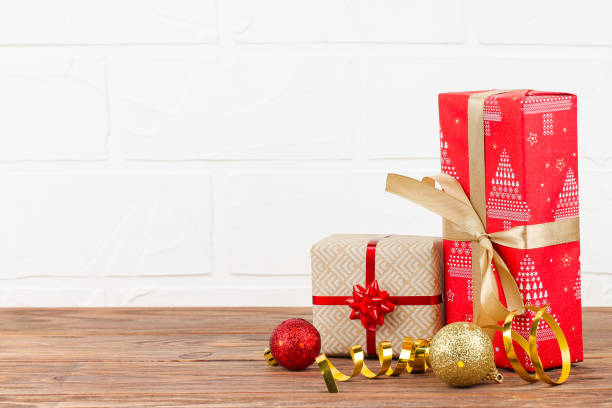 istock The christmas background with gift boxes and decorations. 1186710611