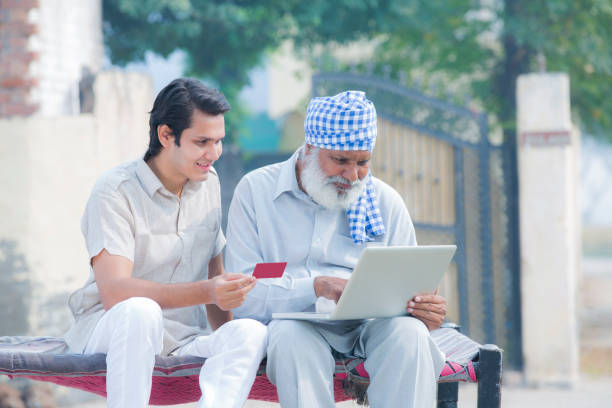 istock Father and son using laptop stock photo 1186712422