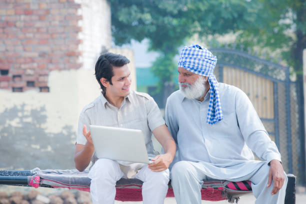 istock Father and son using laptop stock photo 1186713168