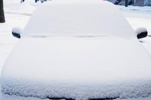 Frozen car covered snow at winter