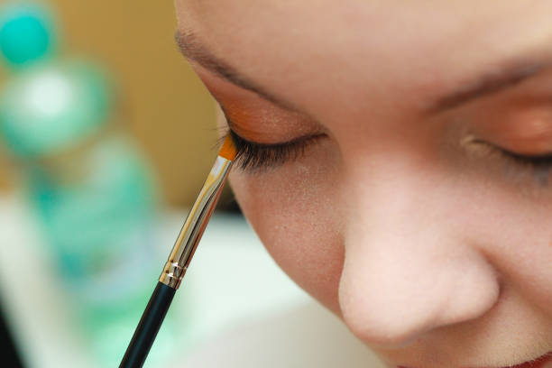 istock Close up woman getting make up, eyeshadow 1186716190