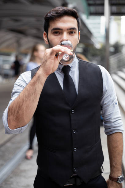 istock Businessman celebrate by drinking wine. 1186718477