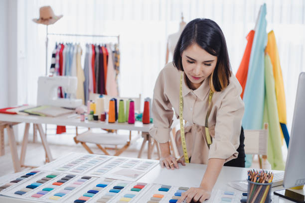 istock Designer are thinking and designing clothes for customers order items. 1186718496