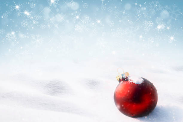istock Christmas ornament with falling snow 1186720475