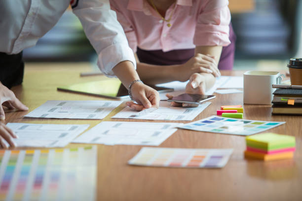 istock The program Graphic design team is helping to select colors for the application on the phone. 1186721372