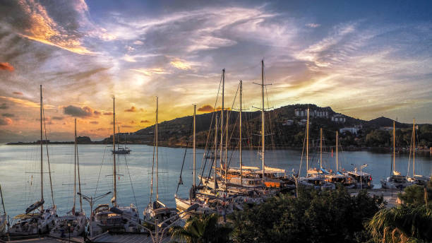 istock Sailing catamaran yachts moored in Datca bay at sunset 1186723605