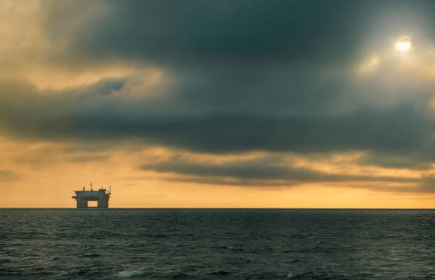 istock Heavy dramatic clouds and bright sky over the Atlantic Ocean. Beautiful african desert sunset 1186726083