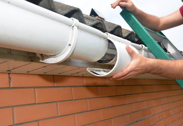 Roof gutter repair. Guttering repair. Roofer contractor repair house rain gutter pipeline. Roof gutter repair. Guttering repair. Roofer contractor repair house rain gutter pipeline. roof gutter photos stock pictures, royalty-free photos & images