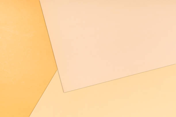 istock Paper color background. Three warm soft pastel peach color 1186727709