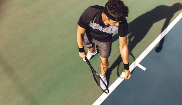 istock Tennis player with racket ready to serve 1186727821