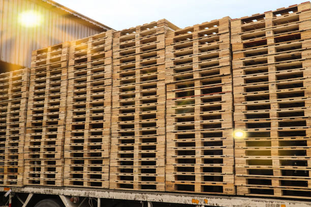 istock Wooden pallets stack at the freight cargo warehouse for transportation and logistics industry 1186728830